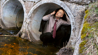 Undecided Voter Silently Crouching Inside Drain Pipe As Convoy Of Political Analysts Passes Overhead